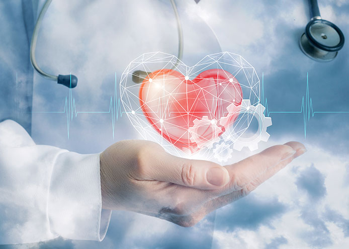 A medical expert holds a virtual heart to illustrate the Heart Rhythm Treatment and care.