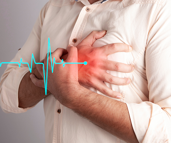 The image of a man holding his chest with heart pulse signals illustrates heart failure.